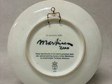 a white plate with a picture of a man on it