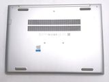 a silver laptop that has a blue sticker on it