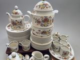 many different types of dishes and cups on a table