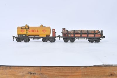 two toy trains that are sitting on a wooden table