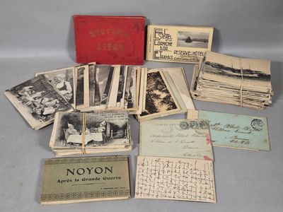 several old postcards are stacked on top of each other on a table