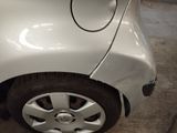 a close up of a car with a denting on the side of it