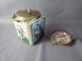 a tea pot and a plate sitting on a table