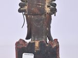 a statue of a man with a bird on his head