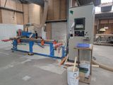 a machine that is working on a piece of wood