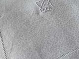 a close up of a napkin with a cross on it