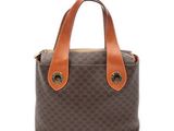 un sac à main marron et beige avec une poignée marron
