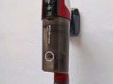 an image of a cordless vacuum cleaner on a wall