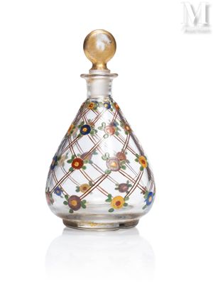 une image représentant un flacon de parfum en verre orné de fleurs colorées