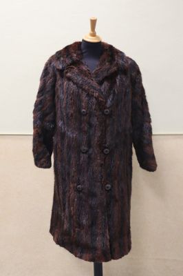 an image of a fur coat on a mannequin stand
