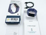 a box with a watch and a charger attached to it