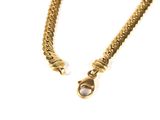 a close up of a gold chain with a clasp on a white background