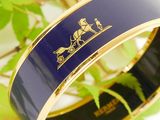 an image of a blue and gold bracelet with a lion on it
