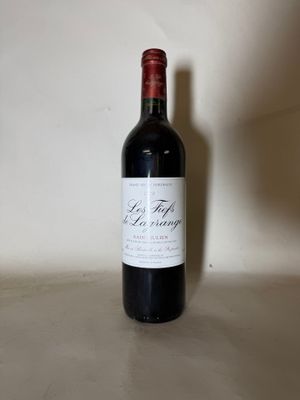a bottle of wine that is sitting on a table