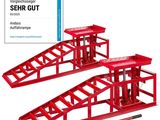 two red jack stands sitting next to each other on a white background