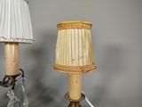 two lamps that are sitting on a glass table