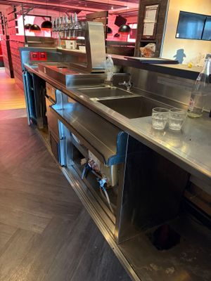 stainless steel counter top in commercial kitchen with stainless steel sink
