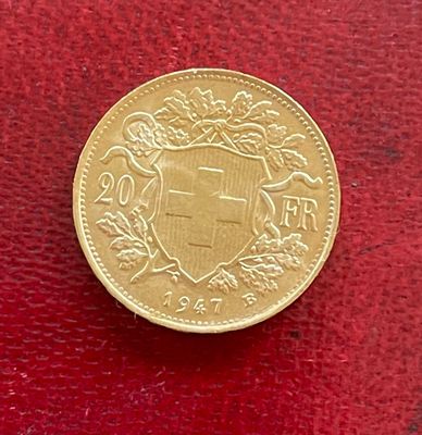 l'image d'une pièce d'or sur laquelle figurent des armoiries