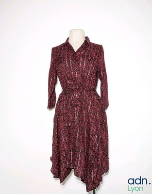 the dress is red and black with a pattern on it