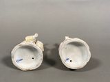 pair of porcelain figurines of a man and a woman
