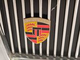 a close up of the emblem on the grill of a car