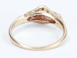 a close up of a ring with a brown stone in it