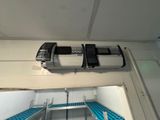 two machines that are sitting on top of a shelf