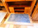 a blue mat on the floor of a wooden cabinet