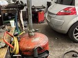 two cars parked in a garage next to a fire hydrant