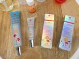 many different types of skin care products sitting on a table