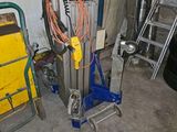 many tools that are sitting on the floor in the garage