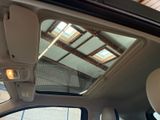 a view of the sunroof from inside of a car