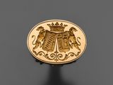un gros plan d'une pièce d'or sur laquelle figurent deux lions
