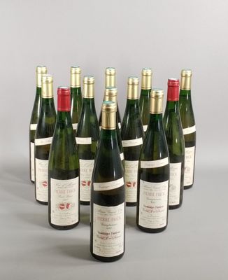 six bottles of wine are lined up in a row on a table