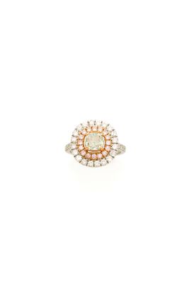a white and yellow diamond ring with a center stone surrounded by small diamonds