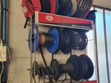a rack with a bunch of different types of hoses on it