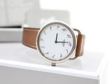 a watch that is sitting on top of a table
