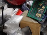 a pile of assorted items sitting on top of a pile of trash