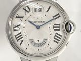a silver watch with roman numerals on the face