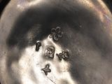 a close up view of a metal object with a hole in it