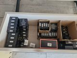 many boxes of electronic equipment sitting on a table