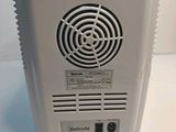an image of a white air conditioner sitting on top of a table