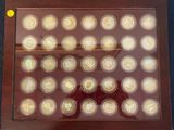 a picture of a picture of a display of gold coins