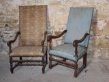 two chairs sitting next to each other in a room