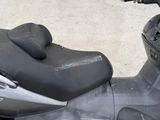 a scooter that has a seat on the back of it
