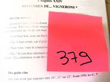 a book with a pink sticker on it and a yellow sticker on the page