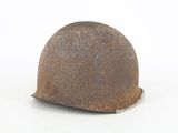 a rusty helmet on a white surface with a white background