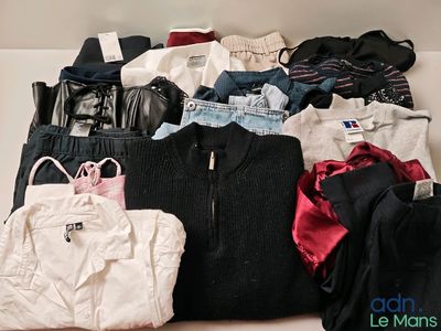 a pile of clothes that is sitting on a table