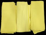 four pieces of yellow cloth folded on top of each other