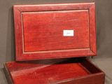 an empty wooden box sitting on top of a table